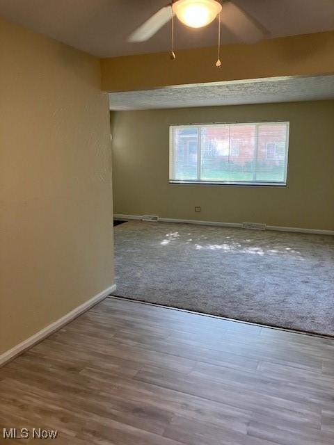 4958 Caroline Dr Unit 6, Warrensville Heights, OH 44128 - carpeted spare room with baseboards and ceiling fan