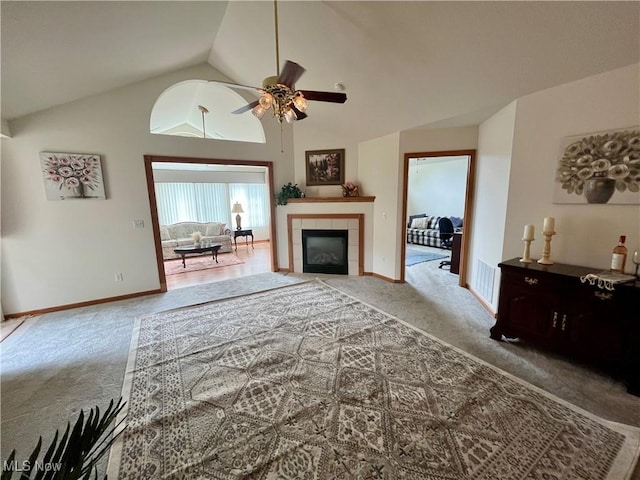 9264 Sharrott Rd Unit 104, Youngstown, OH 44514 - living area featuring carpet, vaulted ceiling, a ceiling fan, and a fireplace