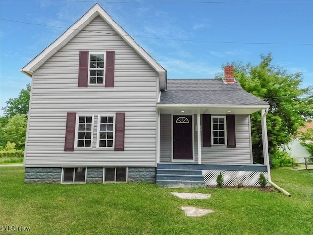 1229 W 45th St, Ashtabula, OH 44004 - view of front of home with a front lawn, a chimney, and roof with shingles