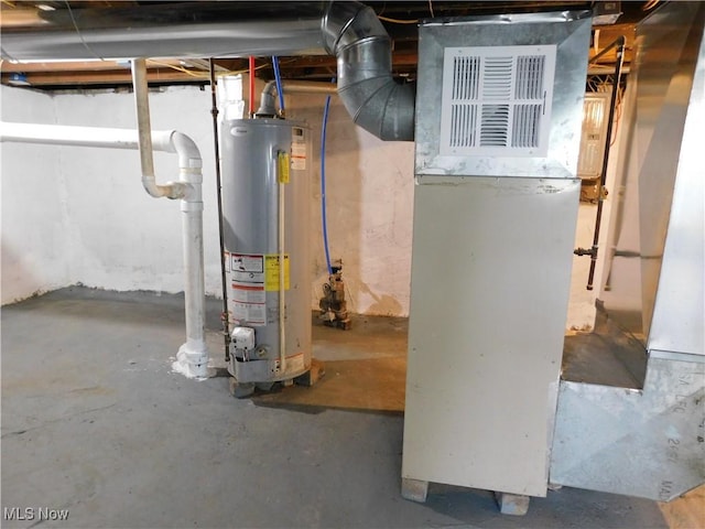 1229 W 45th St, Ashtabula, OH 44004 - utility room featuring water heater and heating unit
