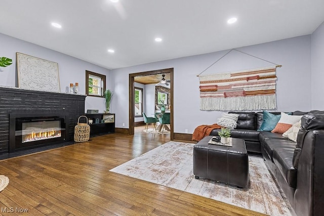 3549 Kent Rd, Stow, OH 44224 - living area featuring wood finished floors, a brick fireplace, recessed lighting, and a ceiling fan