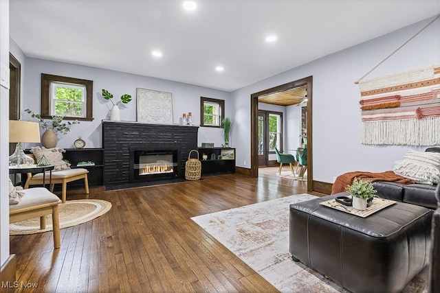 3549 Kent Rd, Stow, OH 44224 - living area with hardwood / wood-style flooring, recessed lighting, and a brick fireplace