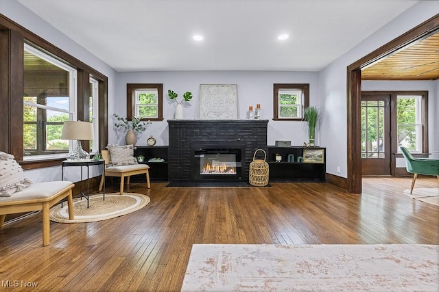 3549 Kent Rd, Stow, OH 44224 - living room with hardwood / wood-style floors, a brick fireplace, and recessed lighting
