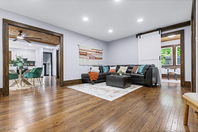 3549 Kent Rd, Stow, OH 44224 - living area featuring dark wood-type flooring, a barn door, and ceiling fan