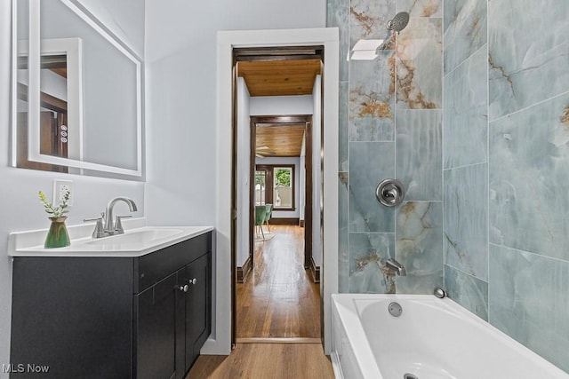 3549 Kent Rd, Stow, OH 44224 - bathroom featuring vanity, wood finished floors, and bathtub / shower combination