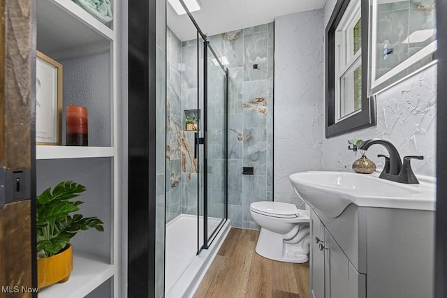 3549 Kent Rd, Stow, OH 44224 - full bath with a textured wall, vanity, wood finished floors, and a stall shower