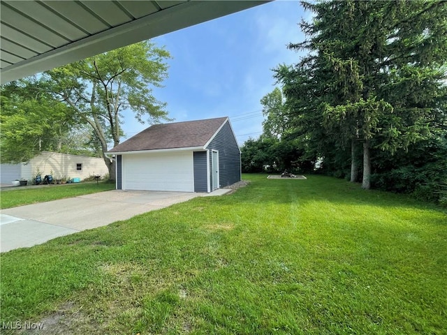 16005 Walvern Blvd, Maple Heights, OH 44137 - view of green lawn featuring an outdoor structure and a detached garage