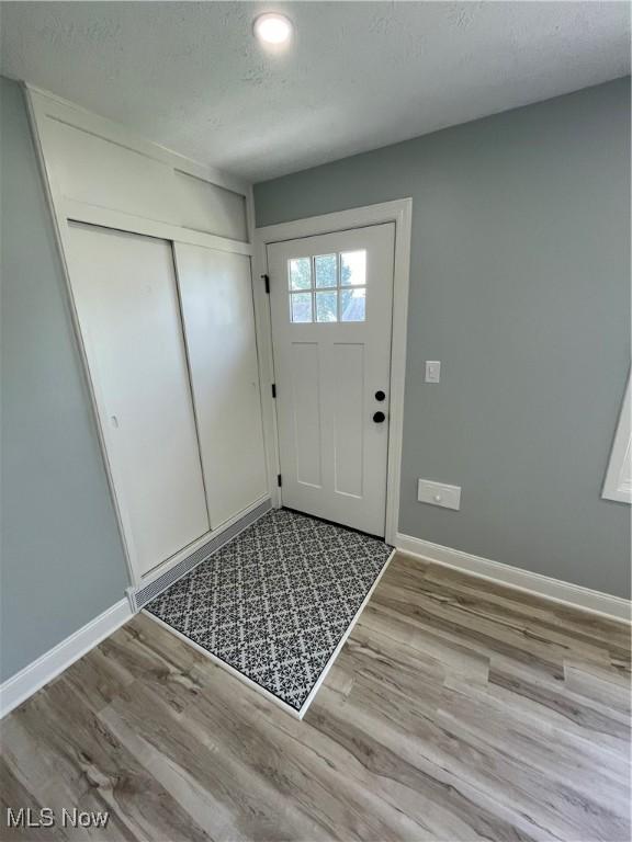 16005 Walvern Blvd, Maple Heights, OH 44137 - entryway with wood finished floors