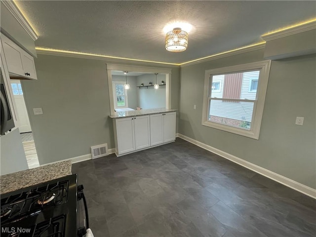 16005 Walvern Blvd, Maple Heights, OH 44137 - unfurnished dining area with ornamental molding and a textured ceiling