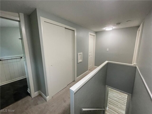 16005 Walvern Blvd, Maple Heights, OH 44137 - hall featuring an upstairs landing, carpet floors, and a textured ceiling