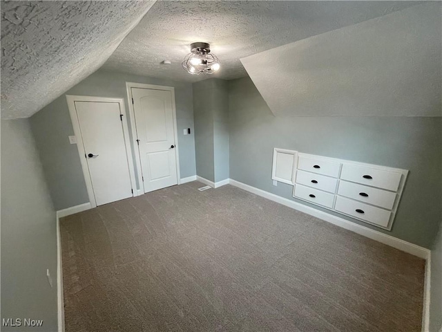 16005 Walvern Blvd, Maple Heights, OH 44137 - additional living space featuring a textured ceiling, vaulted ceiling, and carpet floors