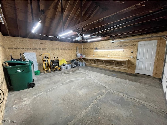 16005 Walvern Blvd, Maple Heights, OH 44137 - garage featuring a garage door opener and a workshop area