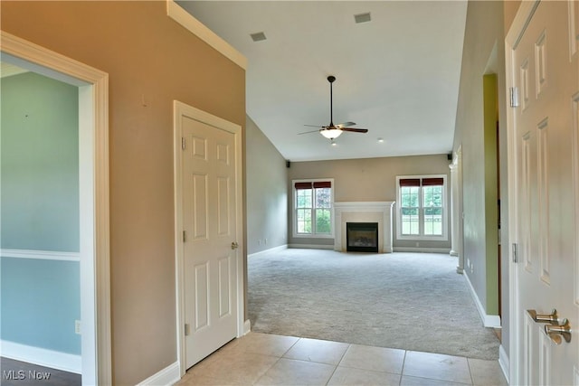 3455 Winners Cir, Canfield, OH 44406 - unfurnished living room featuring light colored carpet, ceiling fan, light tile patterned floors, and a fireplace