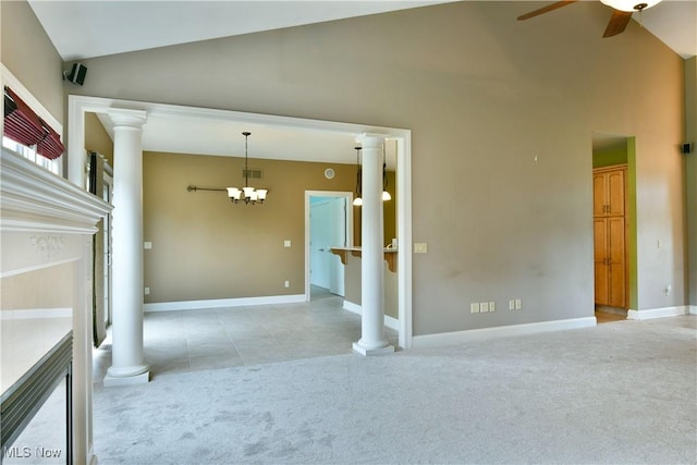 3455 Winners Cir, Canfield, OH 44406 - unfurnished living room featuring light carpet, a ceiling fan, ornate columns, a chandelier, and high vaulted ceiling