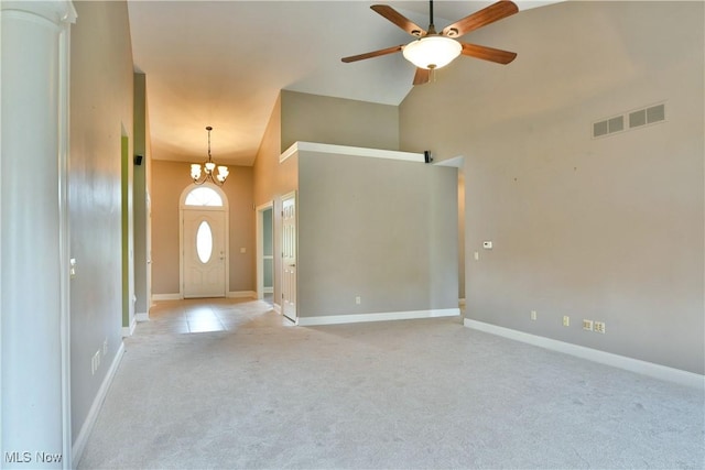 3455 Winners Cir, Canfield, OH 44406 - foyer entrance with light colored carpet, a ceiling fan, a towering ceiling, and a chandelier