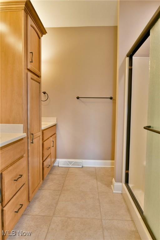 3455 Winners Cir, Canfield, OH 44406 - full bathroom featuring vanity, tile patterned flooring, and a stall shower