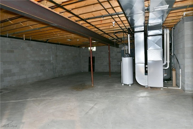 3455 Winners Cir, Canfield, OH 44406 - unfinished basement featuring water heater, concrete block wall, and heating unit