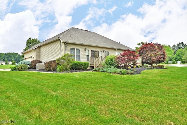 3455 Winners Cir, Canfield, OH 44406 - rear view of house with a lawn and an attached garage