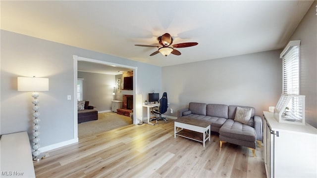 4314 Cheval Cir, Stow, OH 44224 - living area featuring a ceiling fan and light wood-style flooring