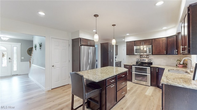 4314 Cheval Cir, Stow, OH 44224 - kitchen featuring stainless steel appliances, dark brown cabinets, light wood-style floors, and recessed lighting