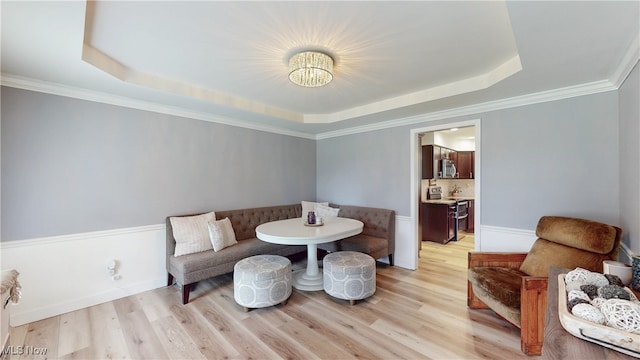 4314 Cheval Cir, Stow, OH 44224 - sitting room with a raised ceiling, a chandelier, light wood finished floors, and crown molding