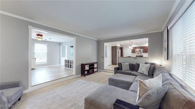 4314 Cheval Cir, Stow, OH 44224 - living area featuring ornamental molding, light carpet, and a ceiling fan
