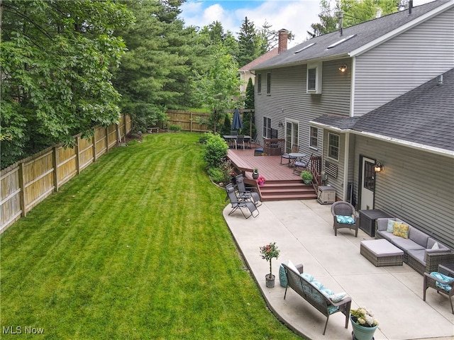 4314 Cheval Cir, Stow, OH 44224 - fenced backyard with a wooden deck, a patio area, and an outdoor hangout area