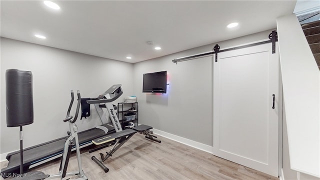 4314 Cheval Cir, Stow, OH 44224 - workout area featuring a barn door, light wood finished floors, and recessed lighting