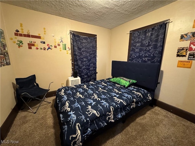 1201 Jackson St SW, Massillon, OH 44647 - carpeted bedroom featuring a textured ceiling and baseboards