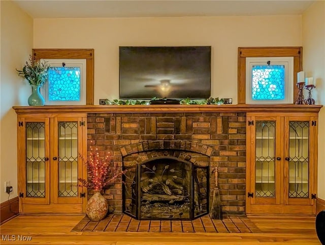 414 W Maple St, Hartville, OH 44632 - detailed view of wood finished floors and a fireplace