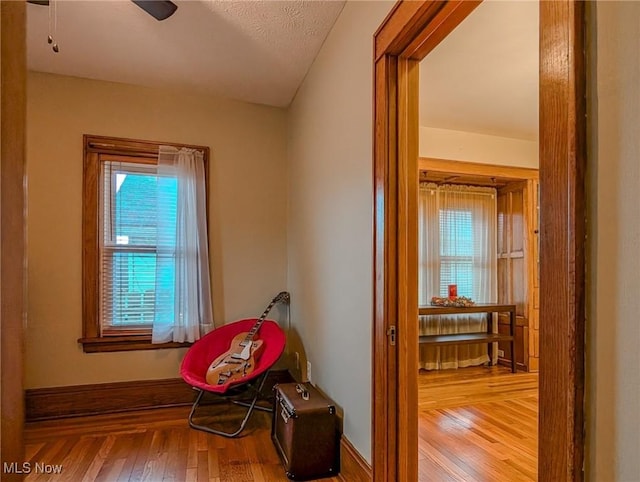 414 W Maple St, Hartville, OH 44632 - sitting room featuring wood finished floors and baseboards