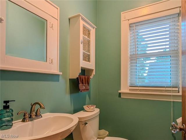 414 W Maple St, Hartville, OH 44632 - bathroom with a sink and toilet