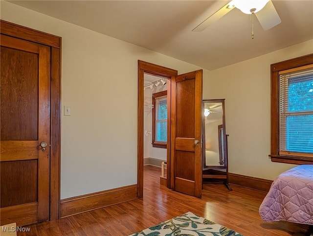 414 W Maple St, Hartville, OH 44632 - unfurnished bedroom with wood finished floors and ceiling fan