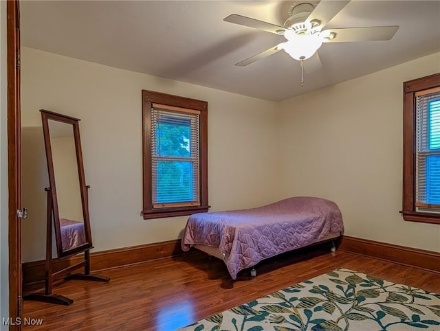 414 W Maple St, Hartville, OH 44632 - bedroom featuring wood finished floors and ceiling fan