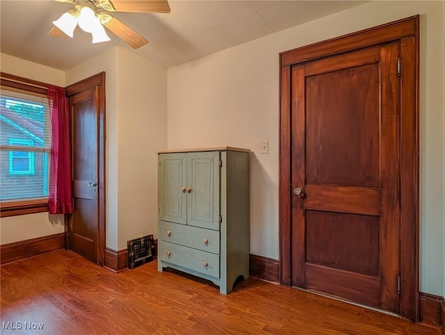 414 W Maple St, Hartville, OH 44632 - bedroom featuring wood finished floors and ceiling fan