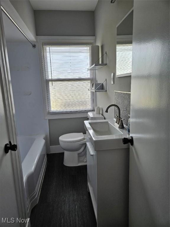 21731 Nicholas Ave, Euclid, OH 44123 - bathroom featuring vanity, wood finished floors, and bathtub / shower combination