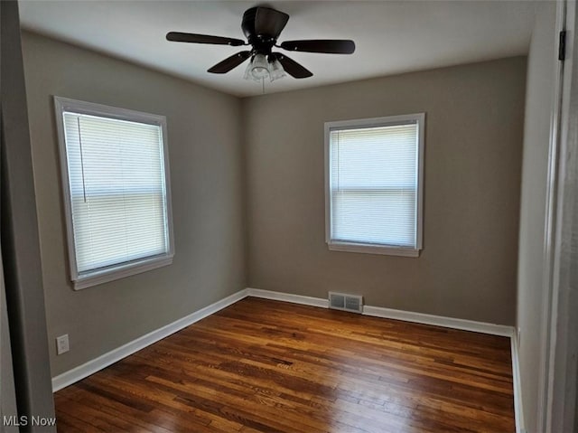 21731 Nicholas Ave, Euclid, OH 44123 - empty room with dark wood finished floors and ceiling fan
