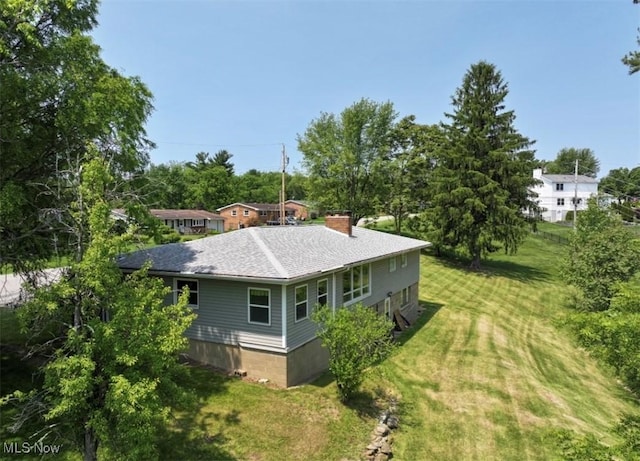 132 Highland Acres, Bloomingdale, OH 43910 - view of property exterior with a chimney, a yard, and a shingled roof