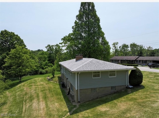 132 Highland Acres, Bloomingdale, OH 43910 - view of property exterior with a yard, a chimney, and a shingled roof