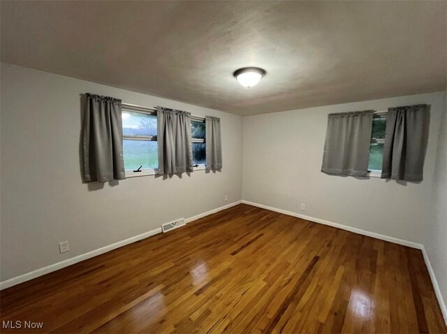 132 Highland Acres, Bloomingdale, OH 43910 - spare room featuring wood finished floors and baseboards