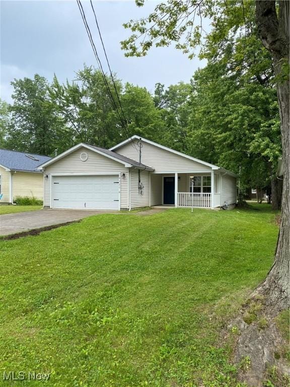 4920 Thomas Blvd, Geneva, OH 44041 - ranch-style home featuring a front yard, covered porch, and an attached garage