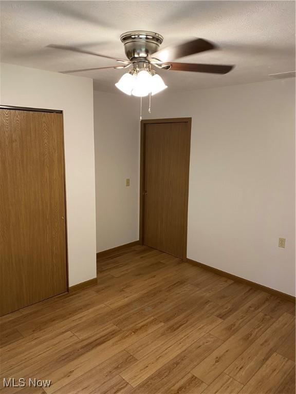 4920 Thomas Blvd, Geneva, OH 44041 - unfurnished room with ceiling fan and light wood-style floors