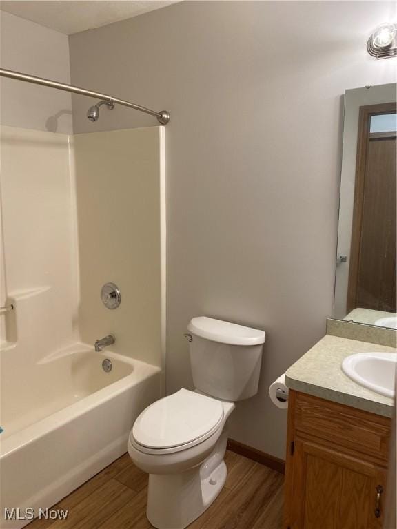 4920 Thomas Blvd, Geneva, OH 44041 - bathroom with wood finished floors, vanity, and tub / shower combination