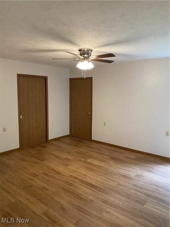 4920 Thomas Blvd, Geneva, OH 44041 - unfurnished room featuring ceiling fan and light wood finished floors
