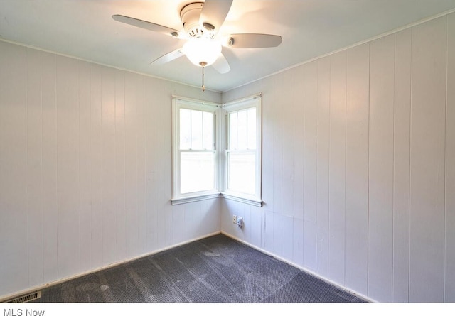 3371 Brecksville Rd, Richfield, OH 44286 - spare room with a ceiling fan and dark carpet