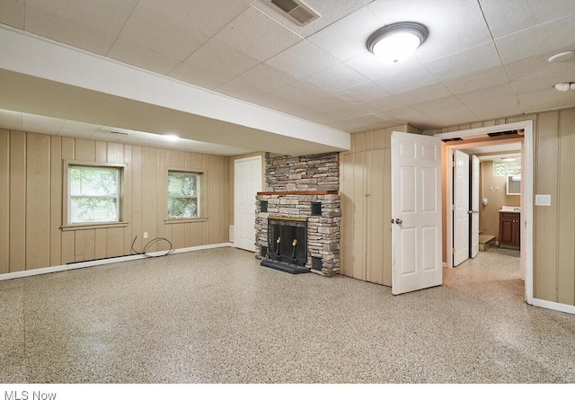 3371 Brecksville Rd, Richfield, OH 44286 - unfurnished living room featuring a fireplace and wood walls