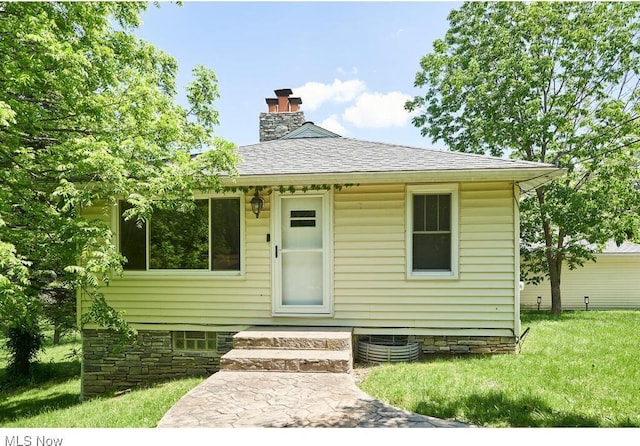 3371 Brecksville Rd, Richfield, OH 44286 - bungalow-style home featuring a chimney, roof with shingles, and a front yard