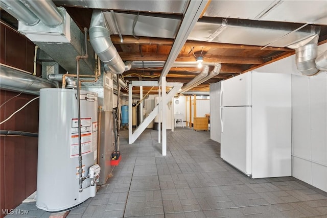 4324 Ormond Dr, New Franklin, OH 44319 - unfinished basement featuring gas water heater and freestanding refrigerator