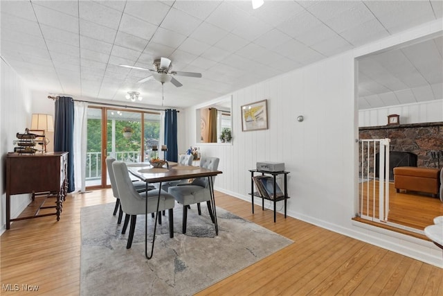 4324 Ormond Dr, New Franklin, OH 44319 - dining area featuring wood-type flooring, ceiling fan, and a fireplace