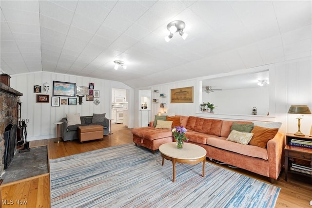 4324 Ormond Dr, New Franklin, OH 44319 - living area featuring wood finished floors and vaulted ceiling